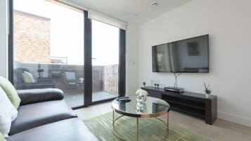 Basic Apartment, 2 Bedrooms | Living area | Flat-screen TV