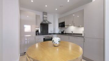 Basic Apartment, 2 Bedrooms | Private kitchen | Fridge, microwave, stovetop, dishwasher