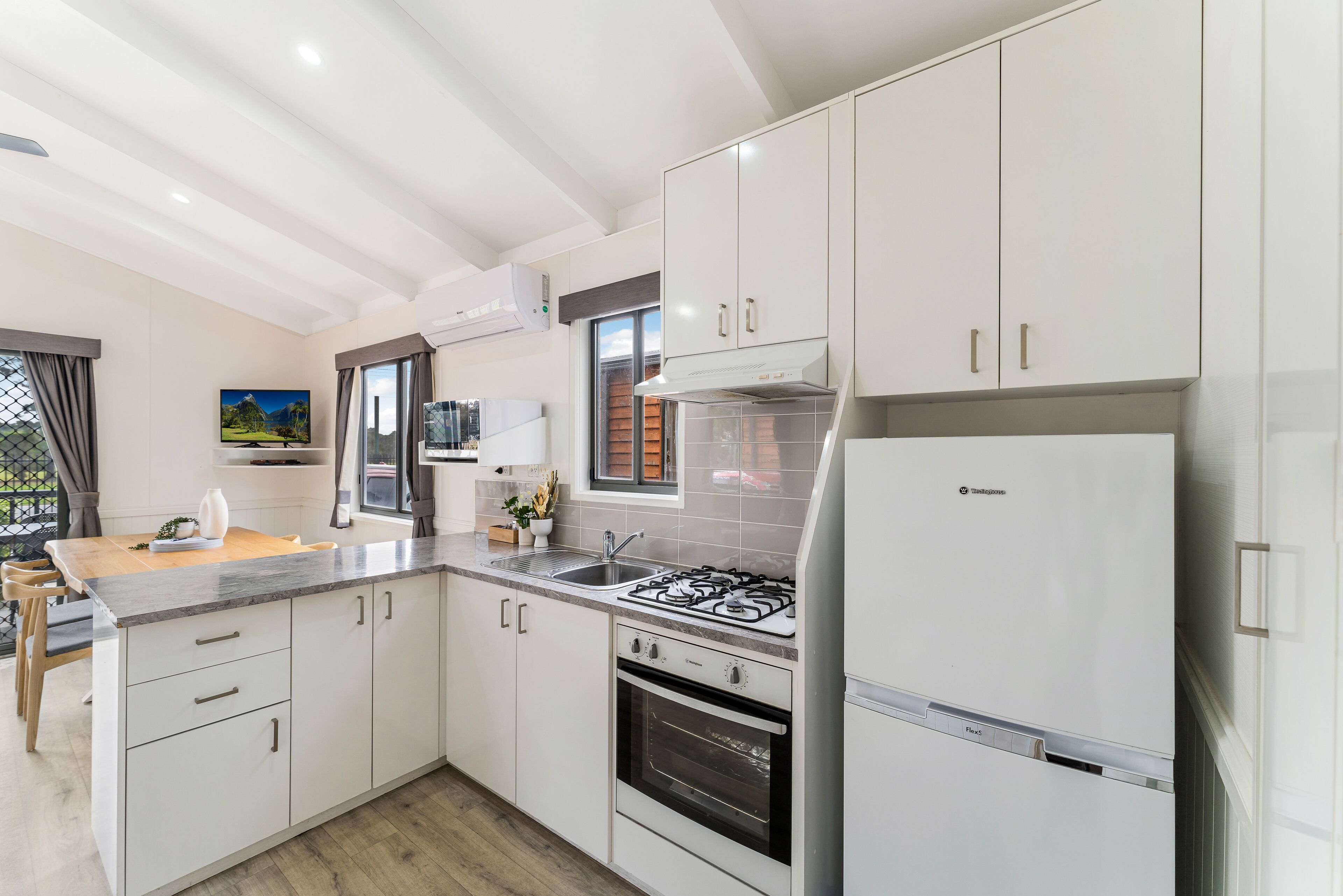 Deluxe Three Bedroom Cabin (with balcony) | Private kitchen | Full-size fridge, microwave, oven, stovetop