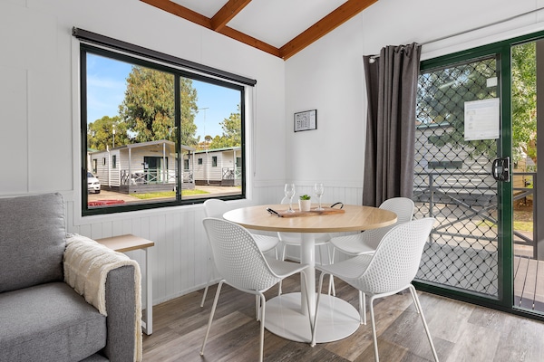 Deluxe Cabin (2BR) - Sleeps 6 | Living area | Flat-screen TV, DVD player