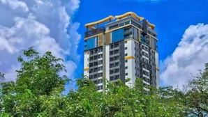 A multi-story building with a modern architectural design, featuring balconies and large windows. - The View Serviced Residence (Phnom Penh)
