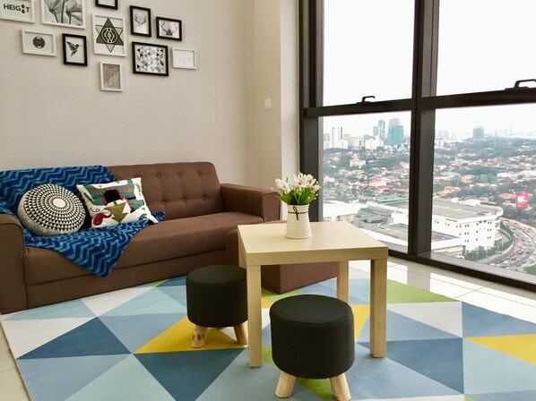 Comfort Duplex, 1 Bedroom, City View | Living area | 32-inch flat-screen TV with cable channels, TV