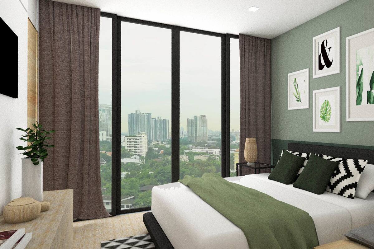 A modern bedroom with a large bed, a city view, and framed botanical prints on the wall.