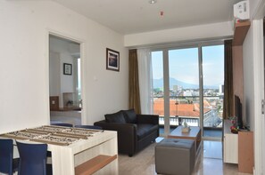 Family Apartment, 2 Bedrooms | Living area | Flat-screen TV - Private Landmark Paskal Condonium (Bandung)