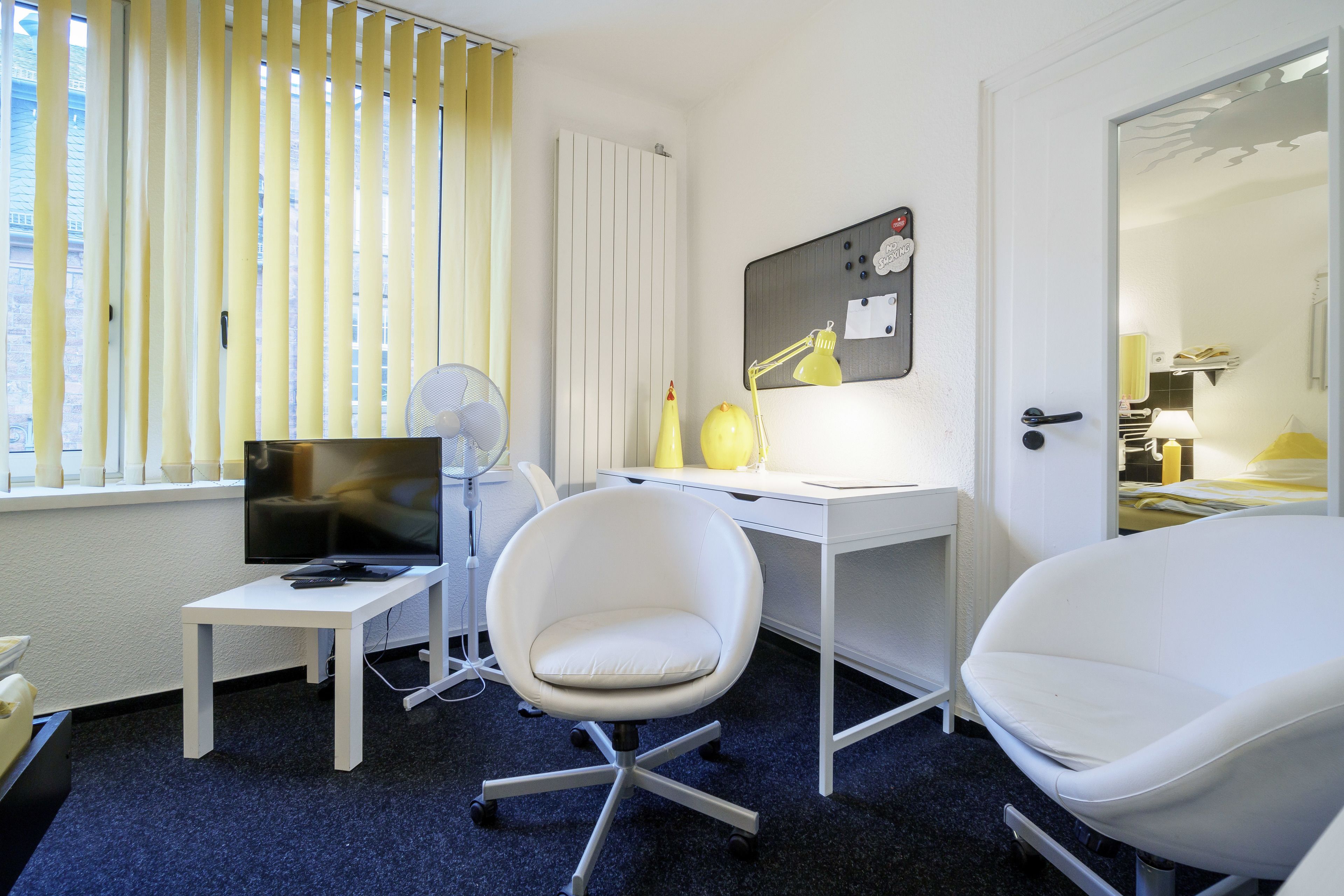 double room, shared bathroom | living area | flat-screen tv