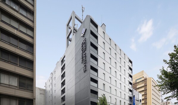 A modern hotel building with a prominent sign indicating it is a hotel. - Hotel Mystays Nagoya Nishiki (Nagoya)