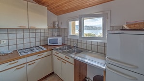 Apartemen, pemandangan laut (2 personnes) | Dapur pribadi | Peralatan masak/sendok-piring