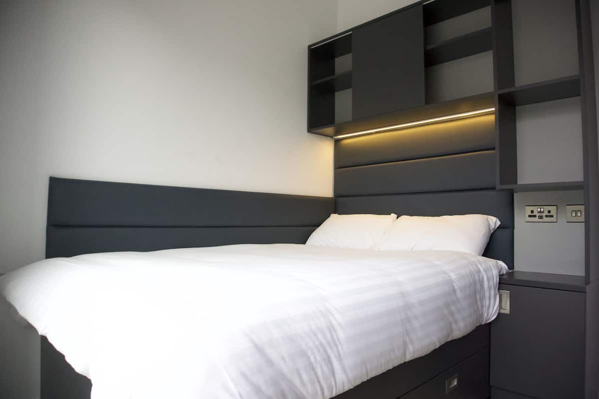Desk, laptop workspace, free WiFi, bed sheets