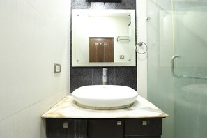 Deluxe Triple Room | Bathroom | Shower, rainfall showerhead, free toiletries, towels - Livia Residency (New Delhi)