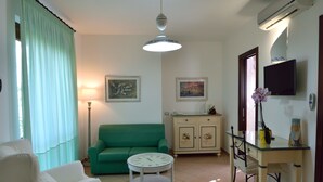 Habitación cuádruple familiar, habitaciones comunicadas | Zona de estar
