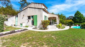 A house with a white exterior, green shutters, a swimming pool, and a well-maintained garden. - VILLA ROCHE GRISE VI3010 by RIVIERA HOLIDAY HOMES (Berre-les-Alpes)