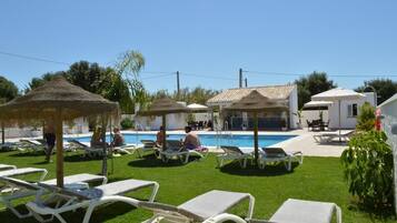 Seasonal outdoor pool, pool umbrellas, pool loungers