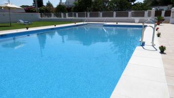 Seasonal outdoor pool, pool umbrellas, pool loungers
