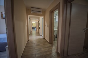 Family Apartment, 3 Bedrooms, Pool View | Premium bedding, in-room safe, individually furnished, desk