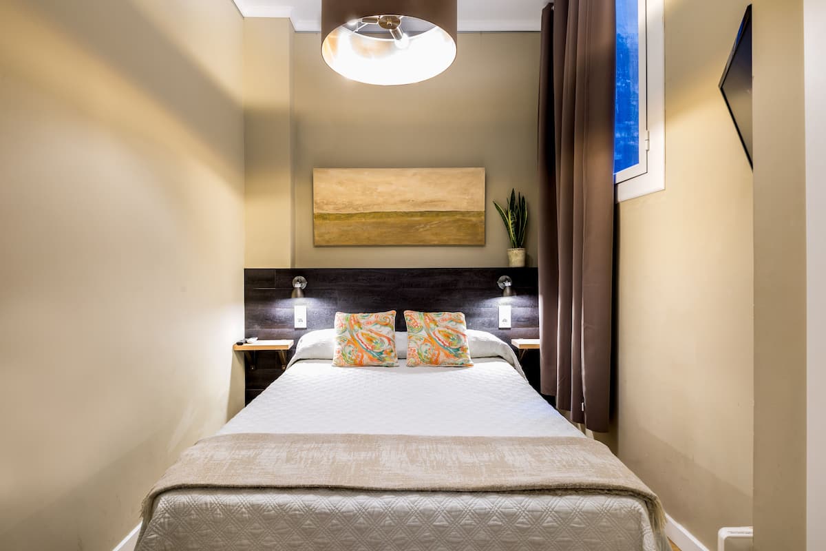Small Double Room Interior | Desk, blackout drapes, soundproofing, free WiFi