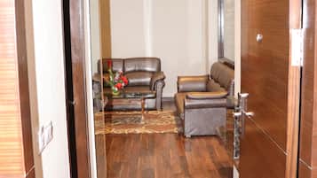 Presidential Suite, 1 Bedroom | Living room | 55-inch Smart TV with digital channels