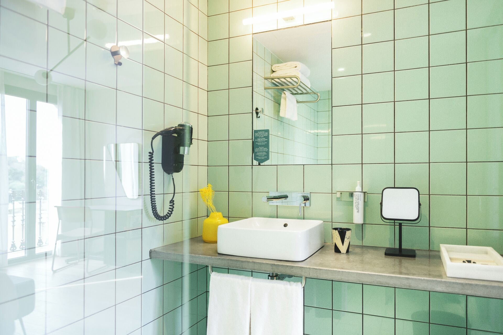 shower, designer toiletries, hair dryer, towels