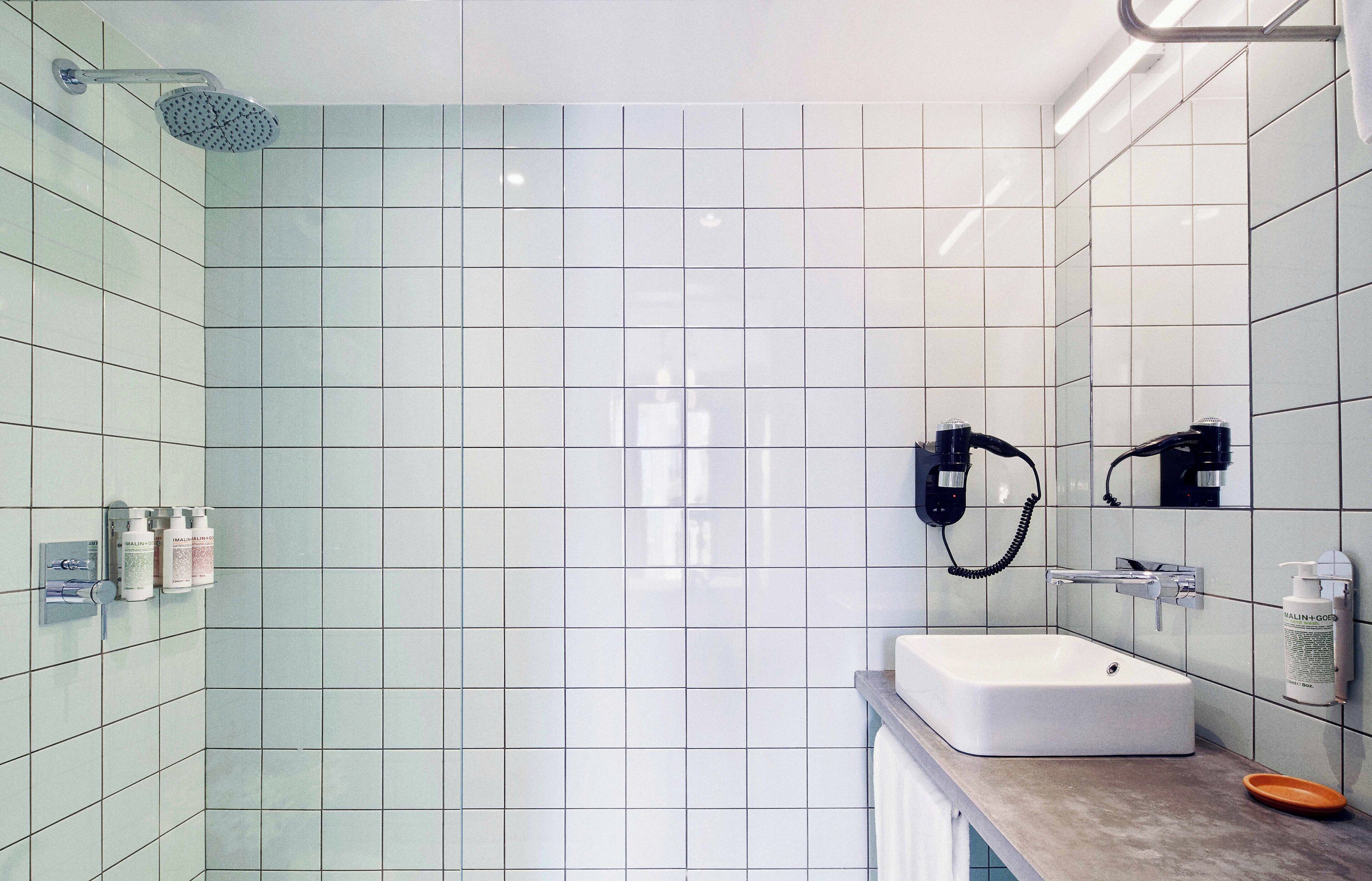 shower, designer toiletries, hair dryer, towels