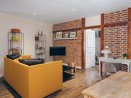 Hector - One Bedroom Apartment | Living area | Flat-screen TV