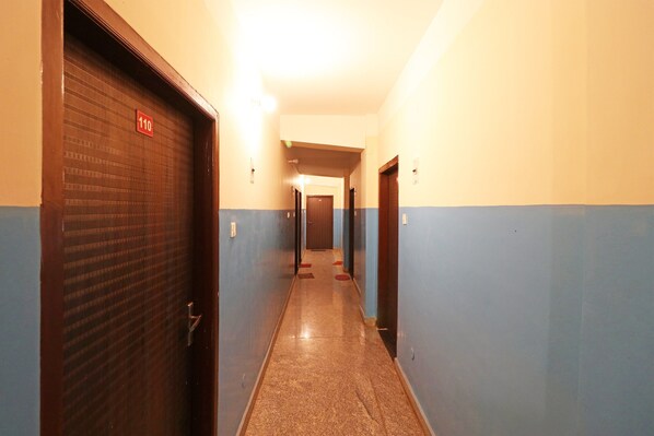 A hallway with doors marked 110 and 111, leading to rooms.