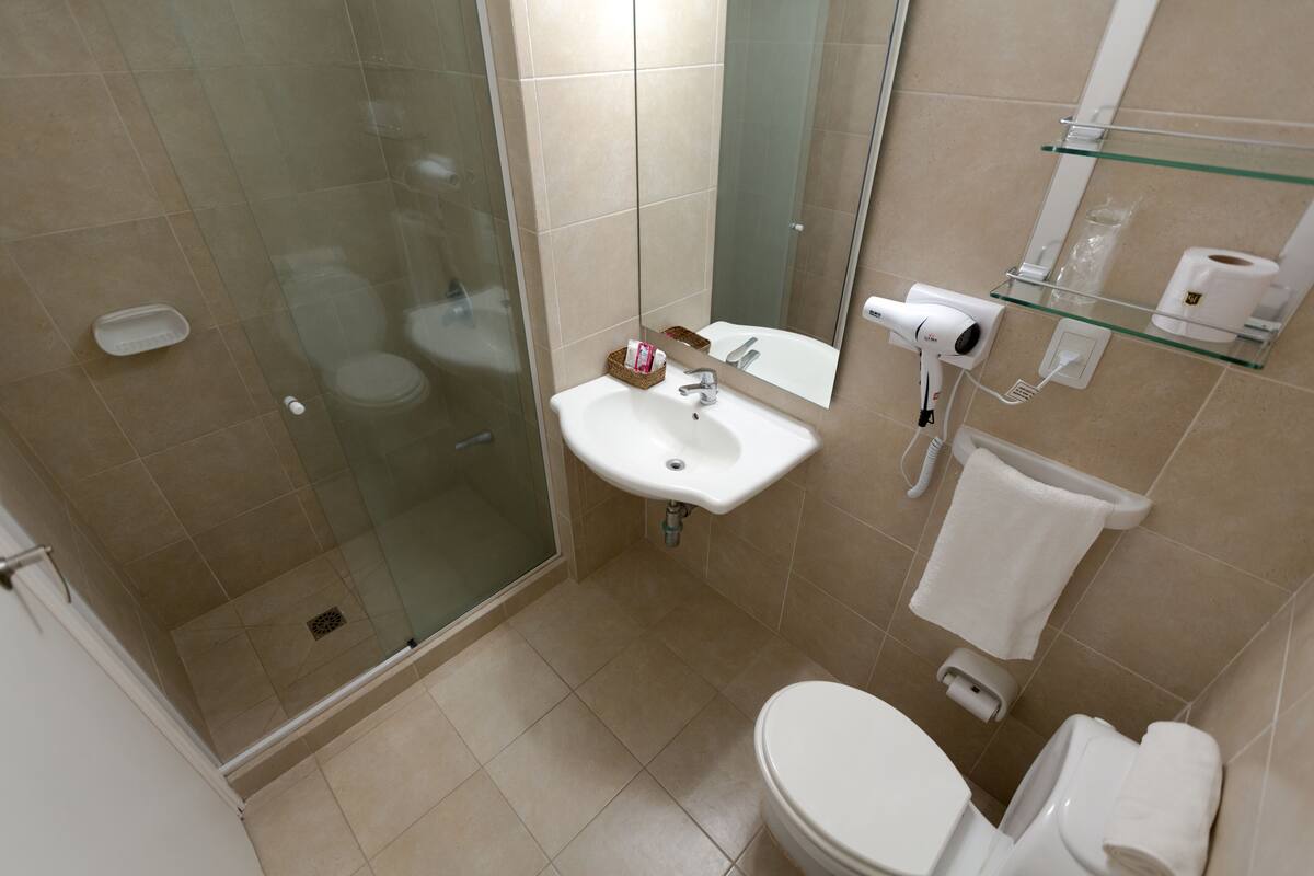 deluxe twin room | bathroom | shower, rainfall showerhead, free toiletries, bidet