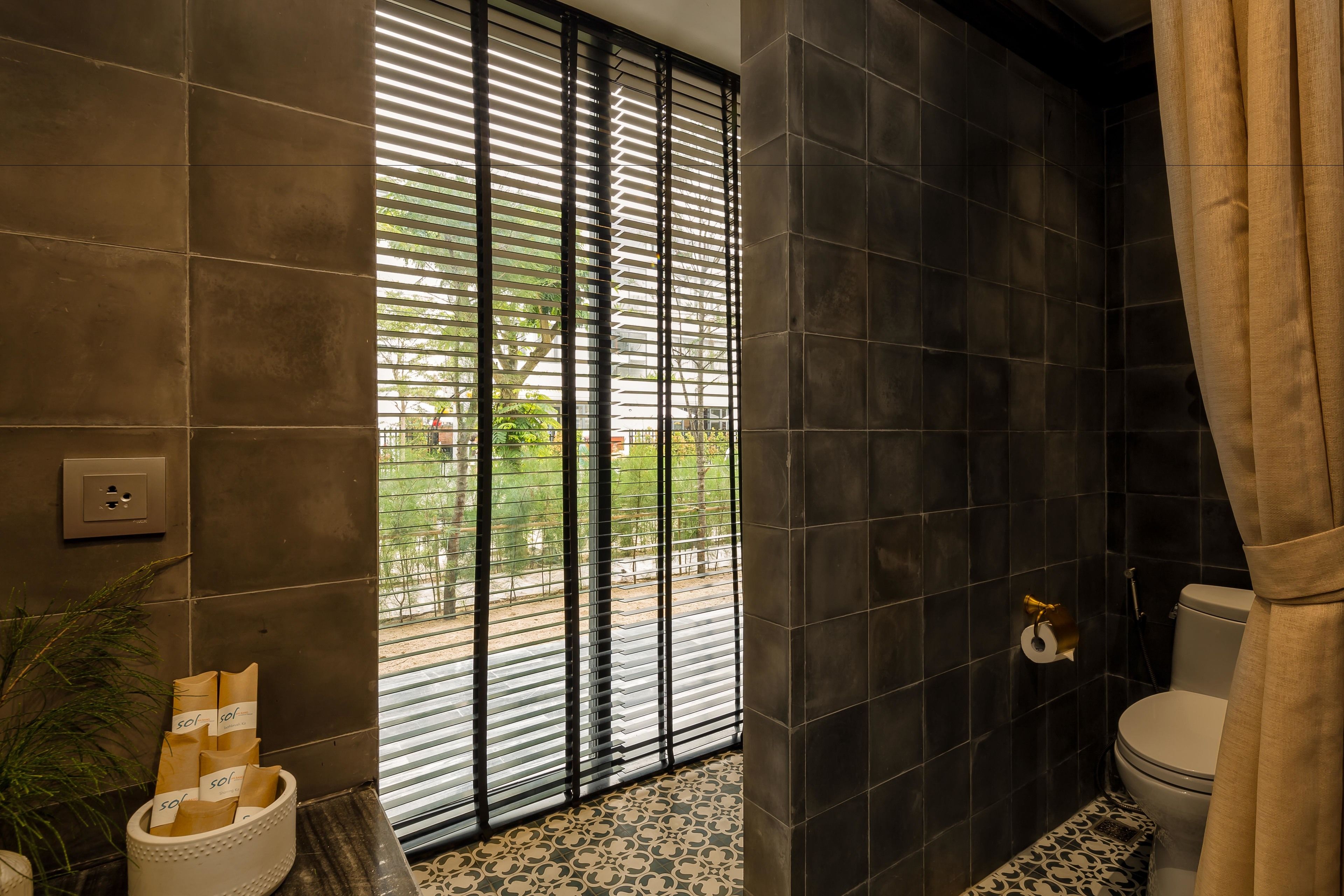 deluxe room | bathroom | designer toiletries, hair dryer, bathrobes, slippers