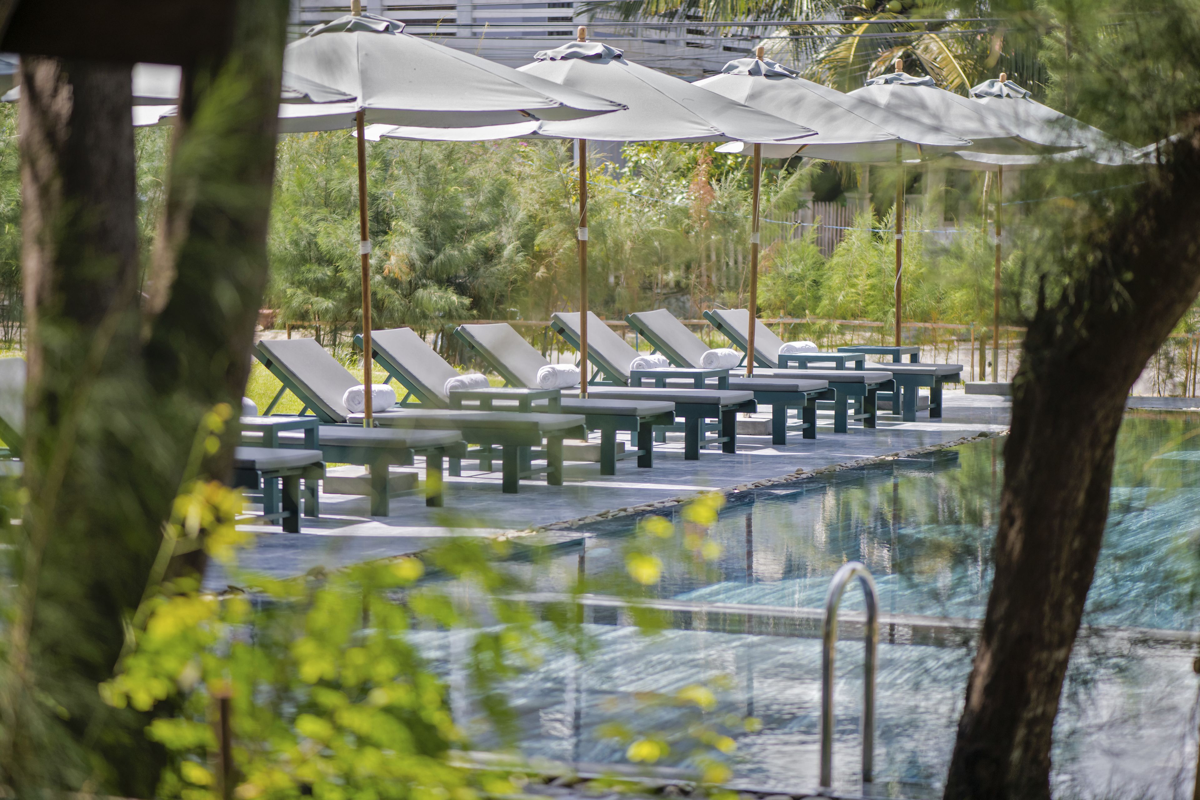 outdoor pool, pool umbrellas, pool loungers