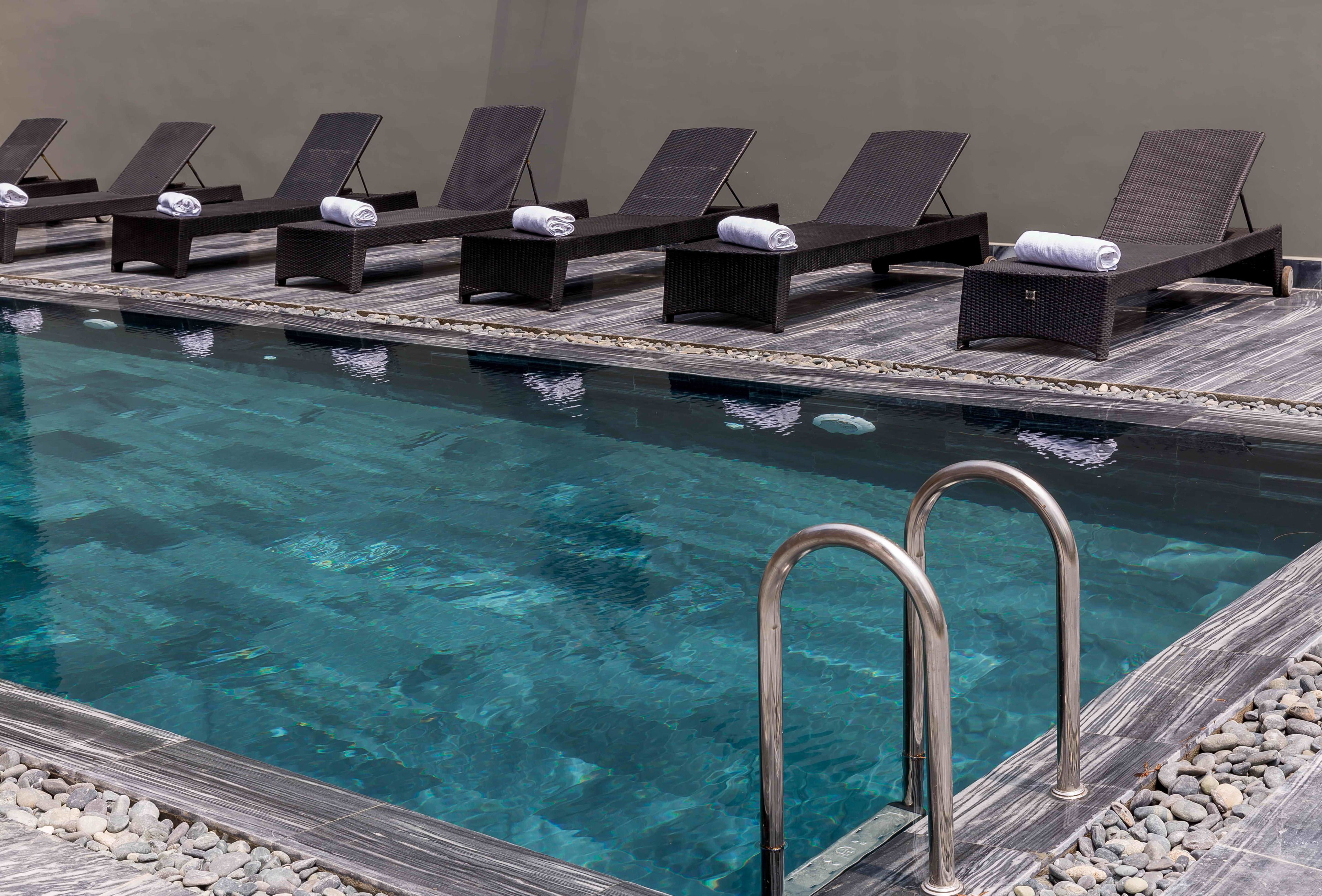 outdoor pool, pool umbrellas, pool loungers