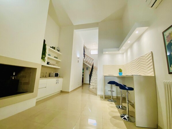 Mini-fridge, microwave, stovetop, cookware/dishes/utensils