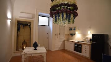 Apartamento superior | Área de estar | TV de tela plana