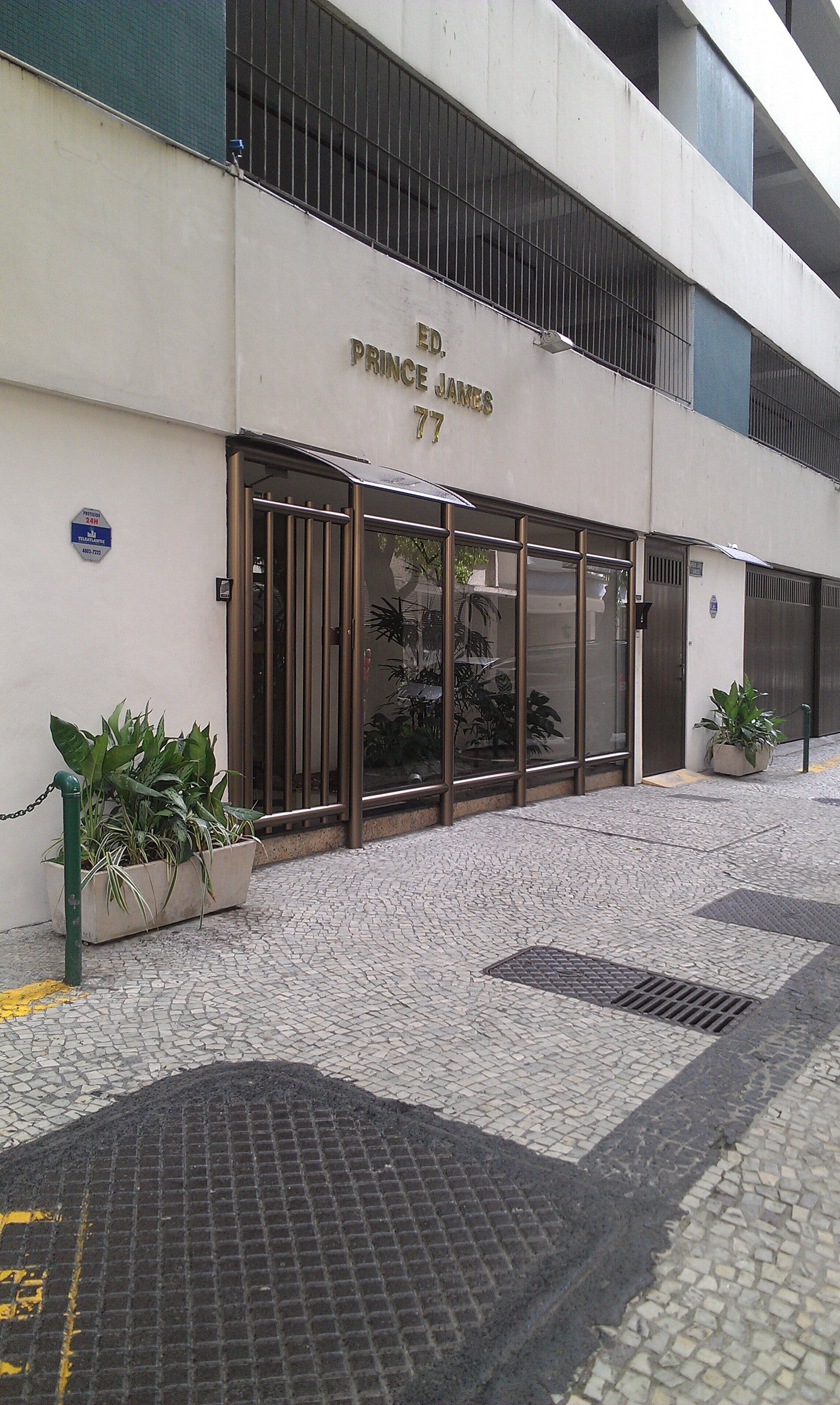 The exterior of a building with a sign reading "ED. PRINCE JAMES 77".