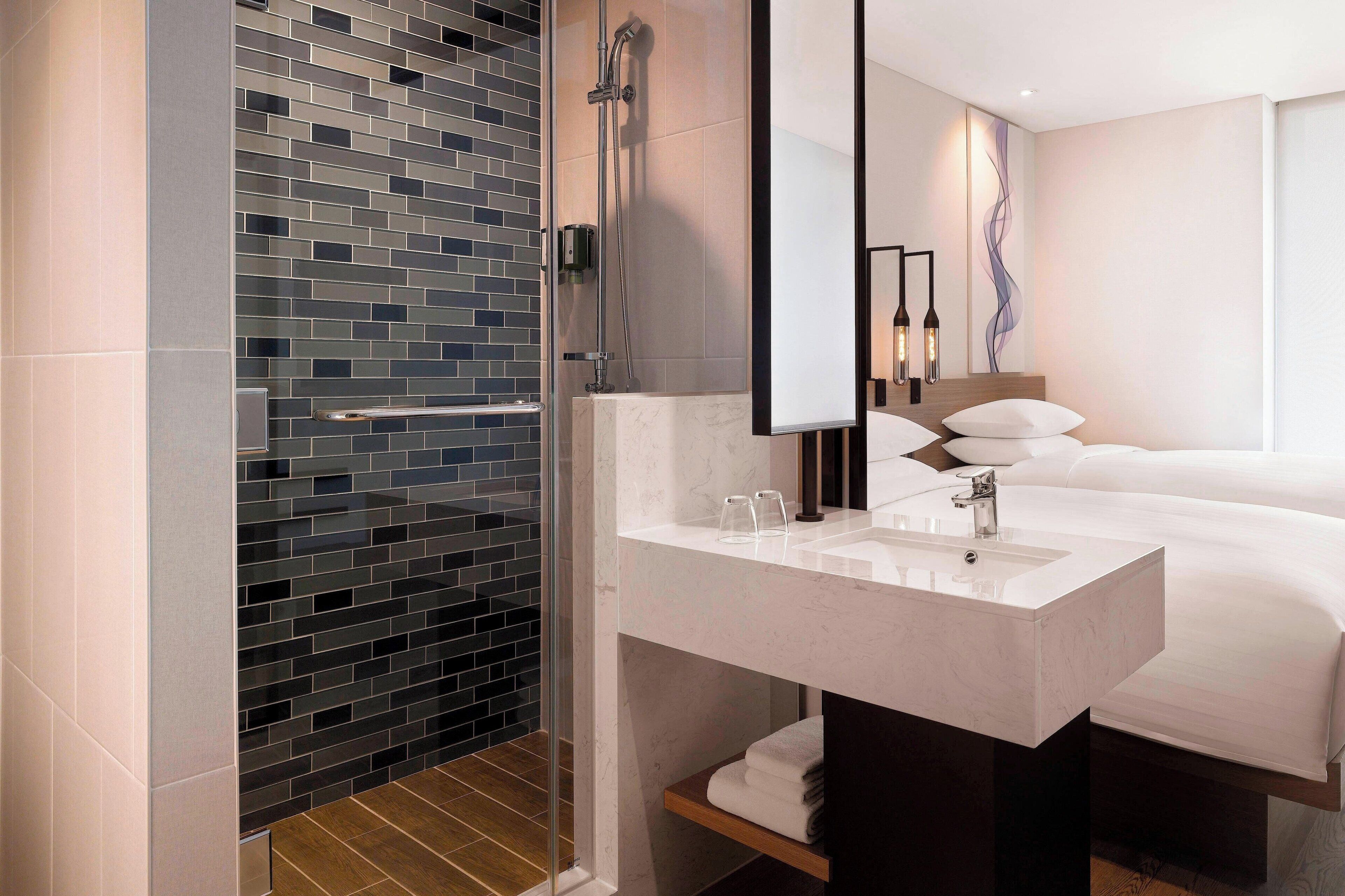 shower, hydromassage showerhead, hair dryer, bathrobes