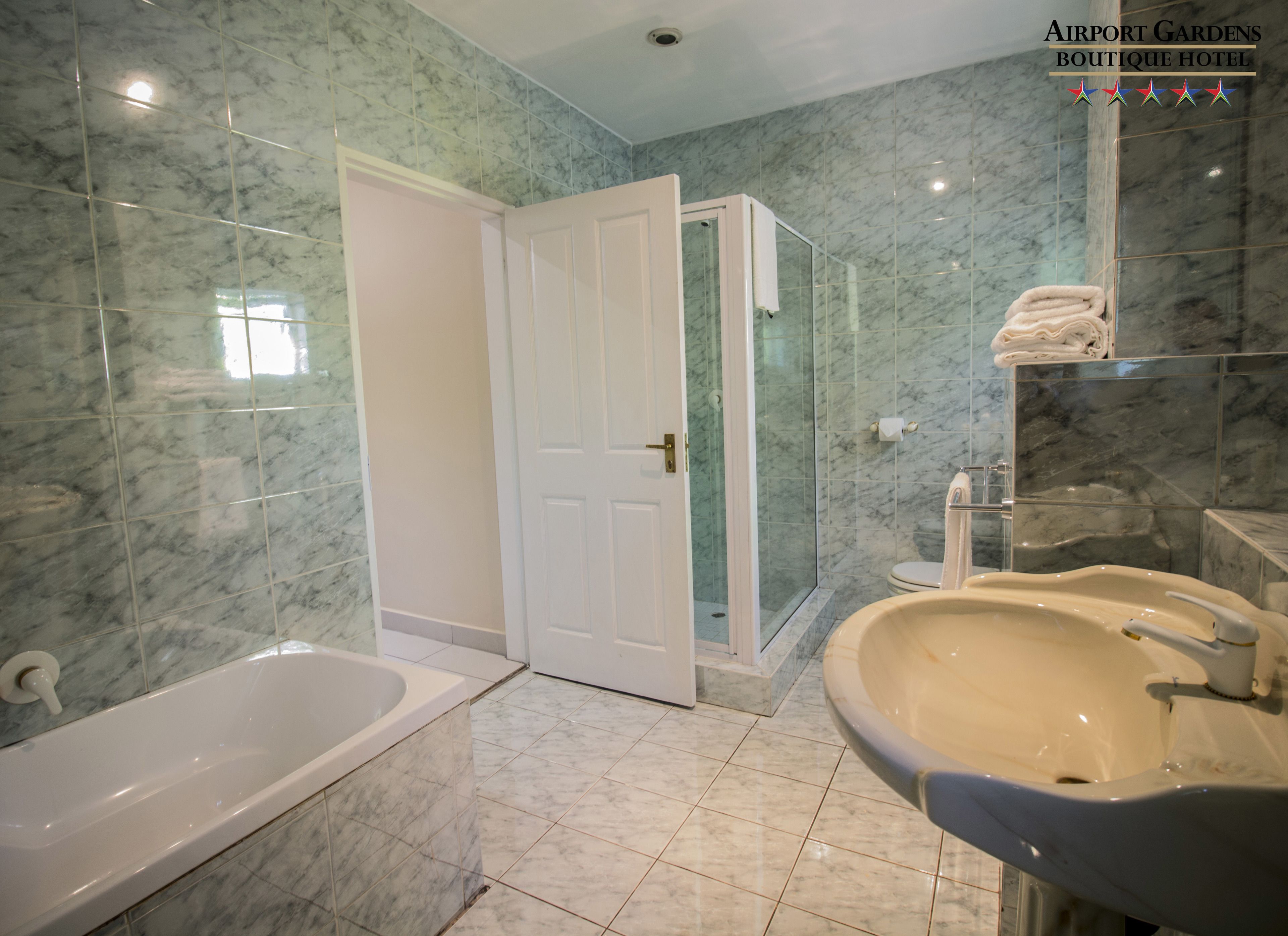 designer toiletries, hair dryer, towels, soap