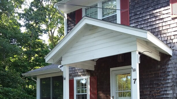 A two-story house with a white porch and red shutters, number 7. - Charming Cape House in Megansett area of North Falmouth - walk to the beach! (North Falmouth)