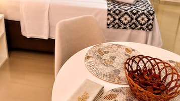 Basic Apartment | Premium bedding, desk, blackout drapes, iron/ironing board