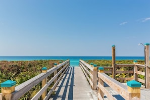 A wooden boardwalk leading to a beach with a clear view of the ocean. - Overlooking 30A!  Great Location! Easy Beach & Pool Access! (Seacrest Beach)