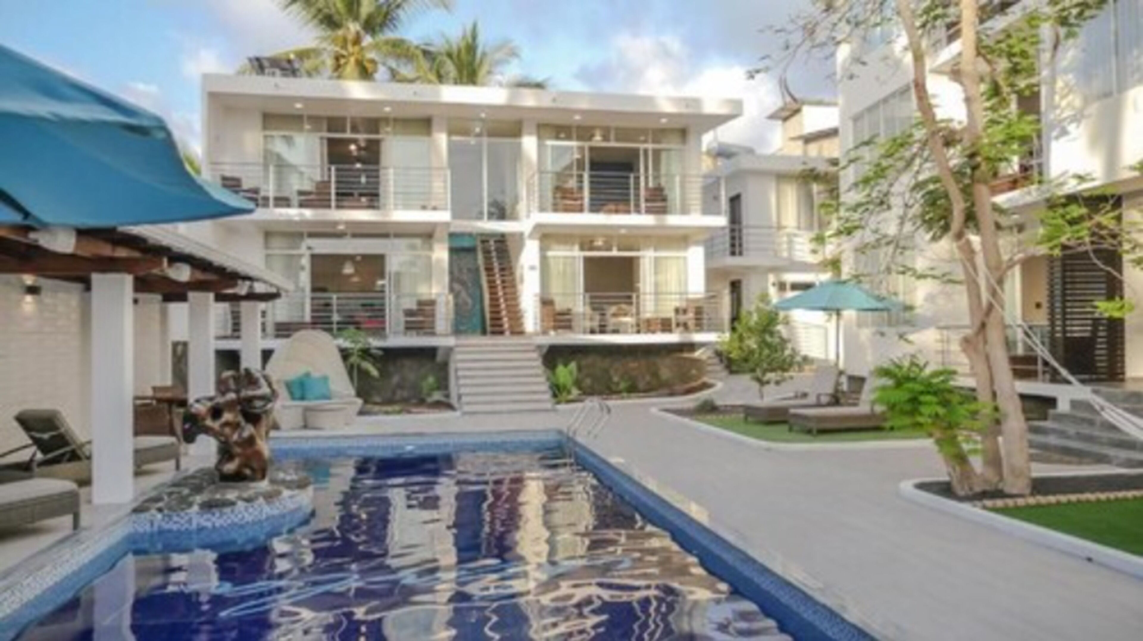 outdoor pool, pool umbrellas, pool loungers