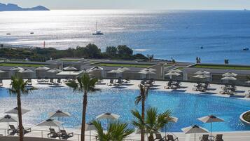 Indoor pool, outdoor pool, pool umbrellas, pool loungers