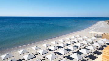 Private beach, black sand, beach cabanas, sun loungers