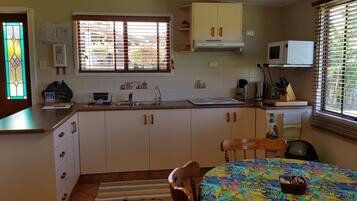 Cottage, 1 Bedroom | Private kitchen | Fridge, microwave, stovetop, cookware/dishes/utensils