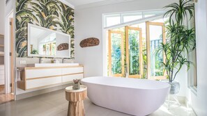 Bathtub, hair dryer, towels, soap