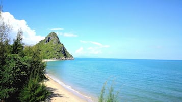 On the beach, sun-loungers, beach umbrellas, beach towels