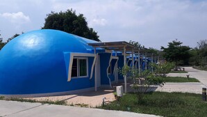 A spherical blue building with a covered entrance and a window. - Eskimo Resort (Phetchabun)