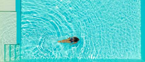 Seasonal outdoor pool, a rooftop pool, pool umbrellas, sun loungers