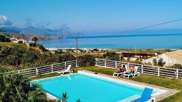 Seasonal outdoor pool, a rooftop pool, pool umbrellas, pool loungers