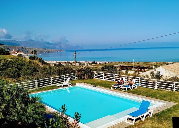 Seasonal outdoor pool, a rooftop pool, pool umbrellas, pool loungers