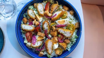 A bowl of salad with various ingredients.