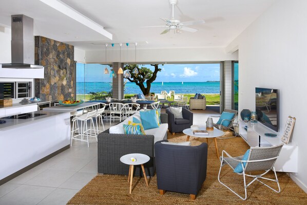 Deluxe Apartment, 4 Bedrooms | Living area | Flat-screen TV, iPod dock - Beach and Pool Poste Lafayette (Poste Lafayette)