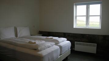 Family Room | Premium bedding, blackout curtains, soundproofing, cots/infant beds