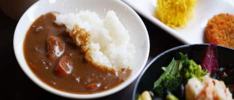 A meal with rice, beans, and vegetables.